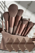18-piece professional makeup brush set in beige fabric pouch on marble surface